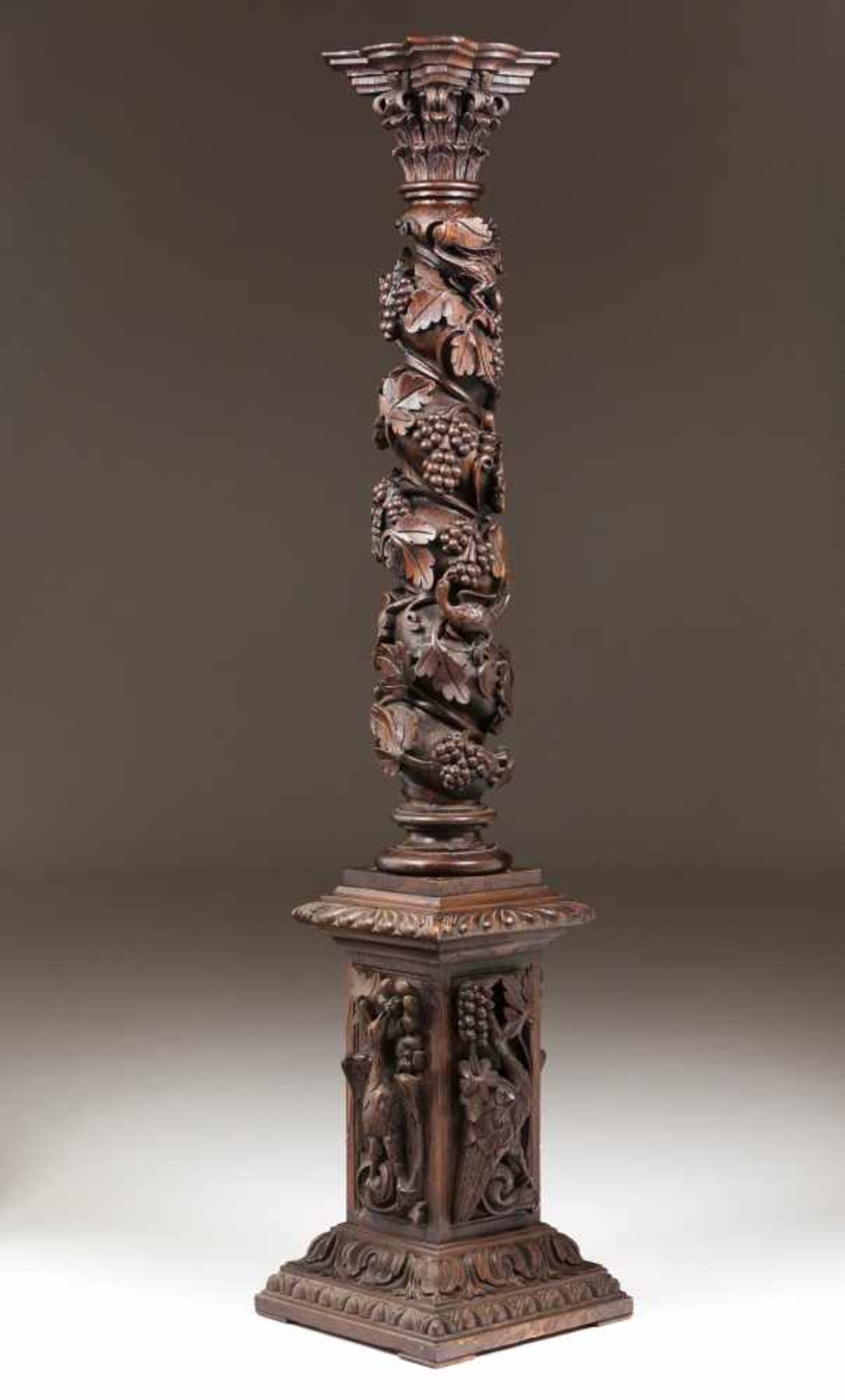 Twisted column with standCarved chestnutDecorated with vines, grapes and birdsCorinthian capital and