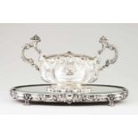 A centrepiece with flower bowlPortuguese silver Oval bowl of raised and chiselled decoration with