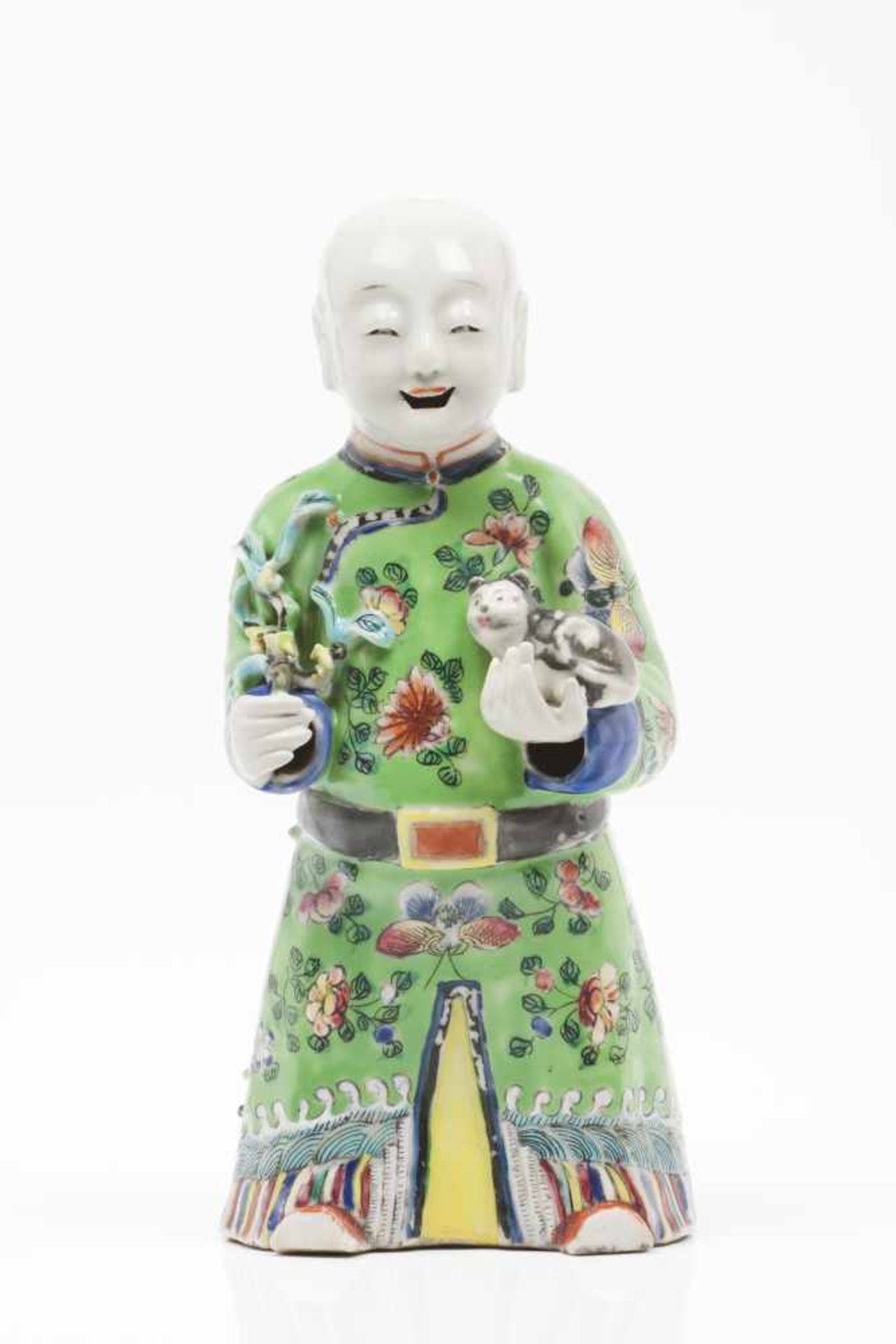 A laughing boyChinese porcelain sculpturesPolychrome decorationQing dynasty, 19th centuryHeight: