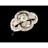 An Art Deco ringPlatinumPlain band toped by linked geometric motifs, set with small rose cut