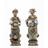 A pair of oriental figuresGlazed stoneware sculpturesPolychrome Sancai decoration(one restored,