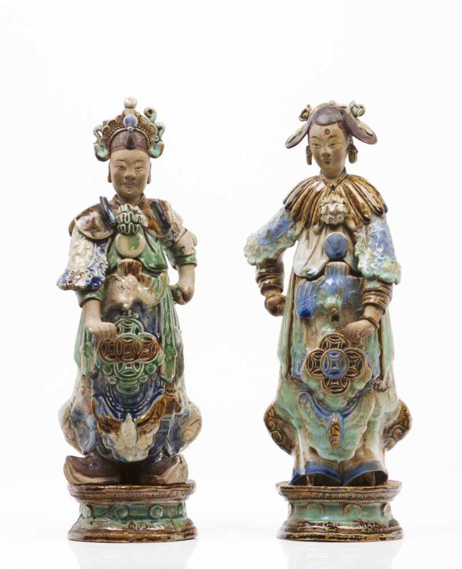 A pair of oriental figuresGlazed stoneware sculpturesPolychrome Sancai decoration(one restored,