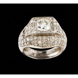 An Art Deco ringPlatinumPlain band of pavé top set with 8/8 cut diamonds and raised geometric