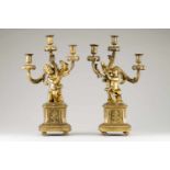 A pair of three branch candelabraGilt bronzePutti and foliage scroll decoration19th century(signs of
