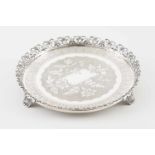 A galleried salver on feetPortuguese silverChiselled base profusely decorated with flowers and