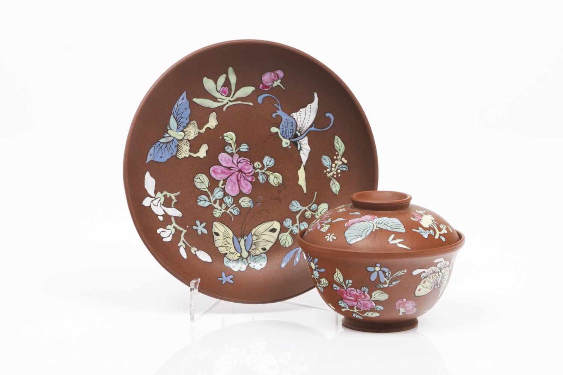 Yixing lided cup and saucerReddish brown clayPolychrome enamelled decoration with flowers and