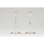 A pair of candlesticksPortuguese silverTurned and striated shaft ending on a circular fluted