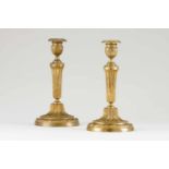 A pair of Louis XVII candle standsGilt bronzeOf neoclassical decoration with foliage scrollsFrance ,