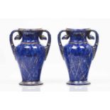 A pair of neoclassical vasesFrench porcelainBlue marbled and gilt decorationVolute handle ending