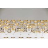 A table glasses setSt.Louis crystal, FranceCut and engraved decoration of gilt frieze12 water, 12