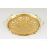 A serving dishSilver and glassMoulded glass dish with gilt silver stand of pierced floral and