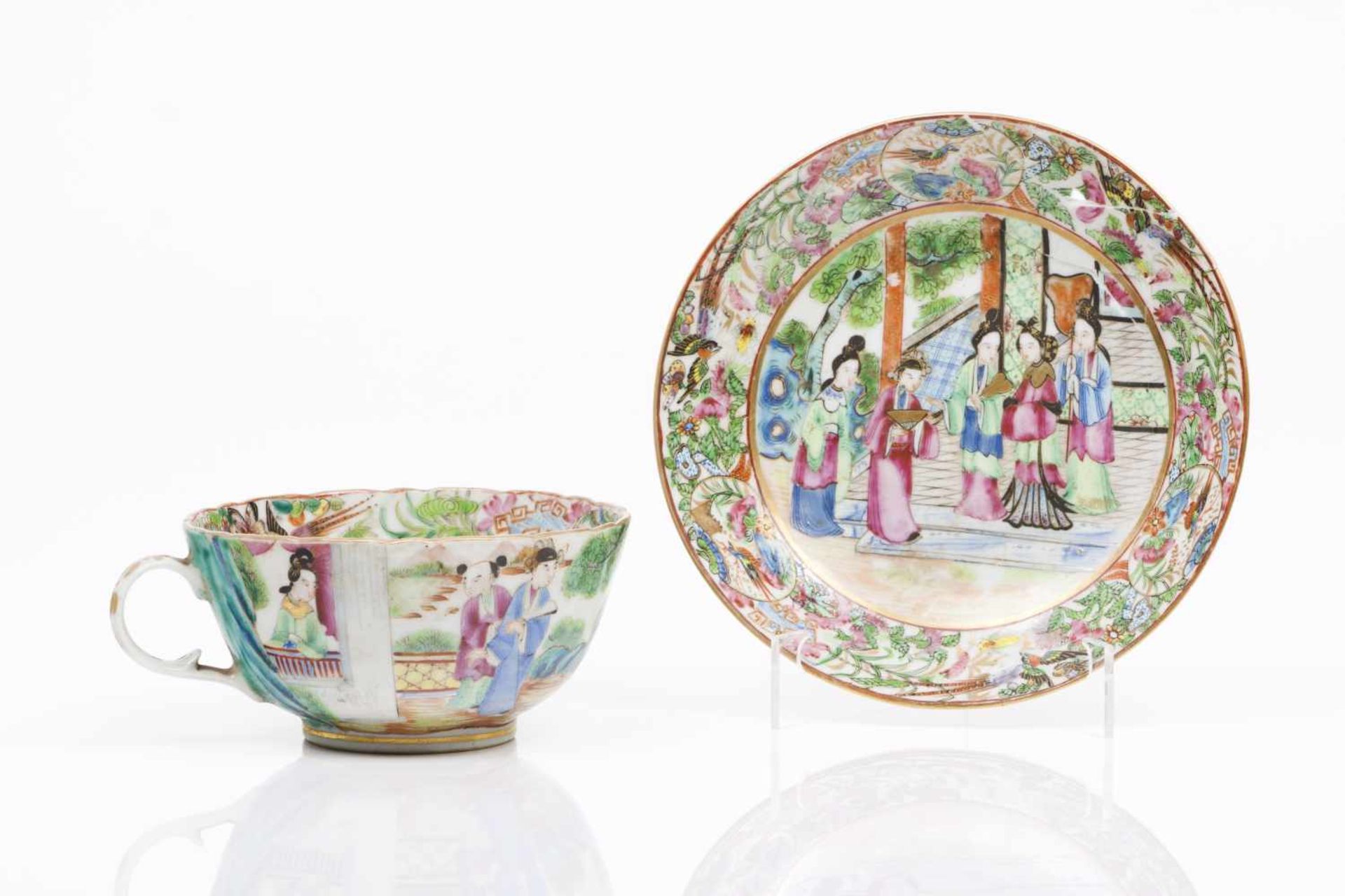 A cup and saucerChinese porcelainPolychrome and gilt decoration said "Canton" depicting chinese