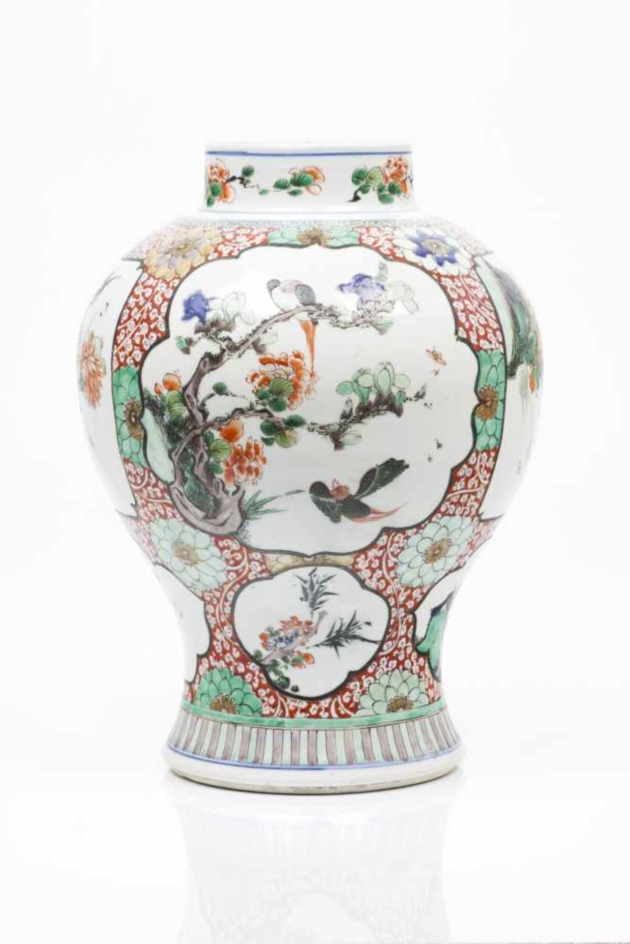 A potChinese porcelain "Famille Verte" enamelled decoration with cartouches of landscapes, flowering