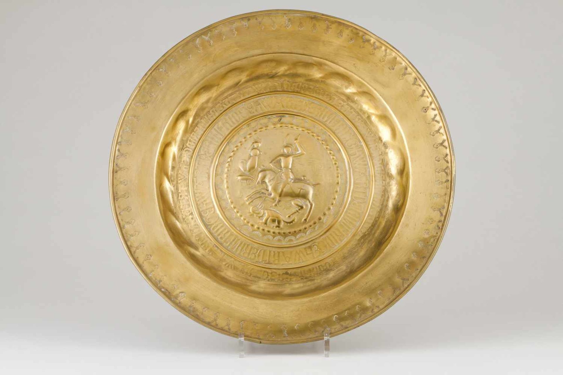 A Nuremberg donations plateYellow metalRaised decoration depicting "Saint George and the dragon"