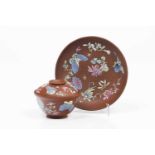 Yixing lided cup and saucerReddish brown clayPolychrome enamelled decoration with flowers and