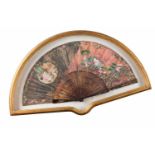 A boxed fanPierced and relief tortoiseshell framePainted leaf depicting chinese daily scenesFramed