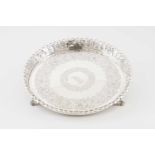 A galleried salver with feetPortuguese silverFlower motifs chiselled base with central monogram