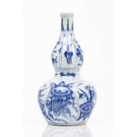 A gourdChinese porcelainBlue underglaze decoration with cartouches of landscape, floral and