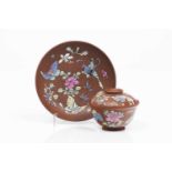 Yixing lided cup and saucerReddish brown clayPolychrome enamelled decoration with flowers and