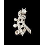 A Mauboussin broochGoldStylised bow set with 7 antique brilliant cut diamonds (ca.3.50ct) and 28