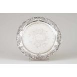 A footed salverPortuguese silverRococo decoration rim and chiselled base with central monogramOn 3