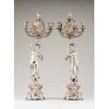 A pair of 6 branch candelabraSilvered metalRococo decorated stands of scrolls and flower motifs