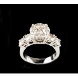 A ringGoldThe centre set with one diamond and 4 navette cut diamonds, total (ca.0.80ct). The ring