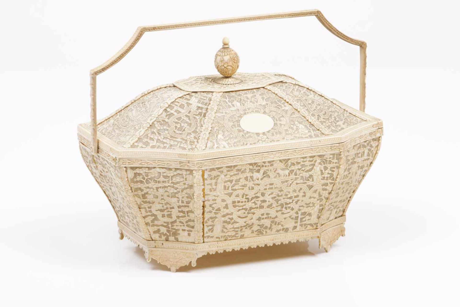 A basket with coverPierced and low relief ivory of flower and foliage scroll motifs, figures,