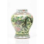 A potChinese porcelain "Famille Verte" enamelled decoration on a yellow ground depicting dragons and