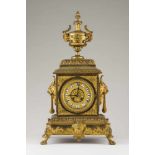 Table clock in imperial style Gilt Bronze Molded and carved decoration with handle masks Enamel dial