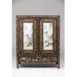 A low cupboardTamarind with mother-of-pearl inlaysDoor fronts with Chinese porcelain plaques of