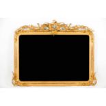 Large mirror in the Louis XV style Carved gilt wood and gesso Profusely decorated in foliage