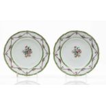 A pair of scalloped plates