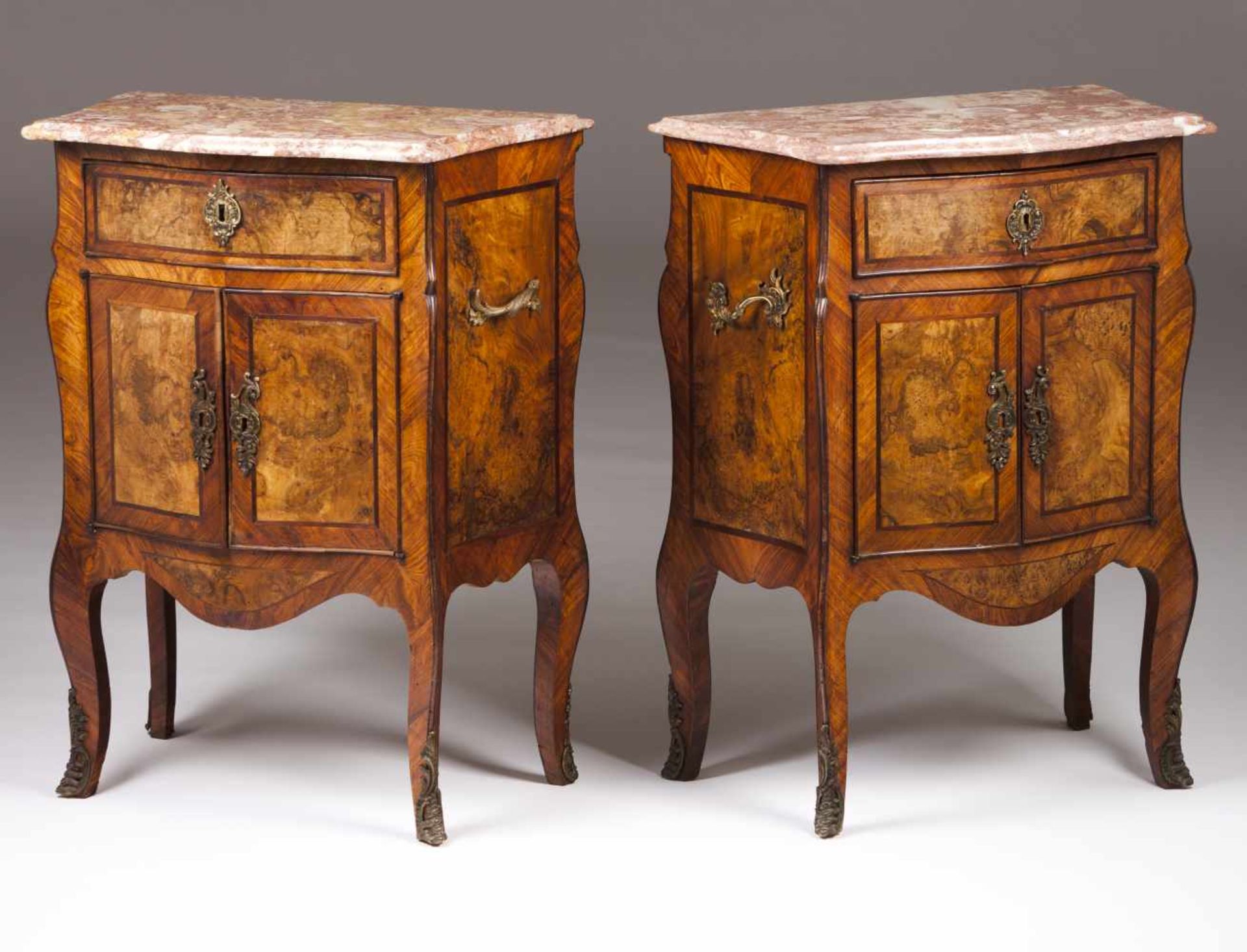 A pair of Louis XV style bedside tables