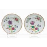 A pair of scalloped plates