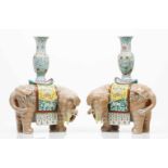 A pair of elephant shaped candle stands