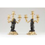 A pair of Napoleon III three light candelabra