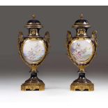 A pair of large Sevres style urns