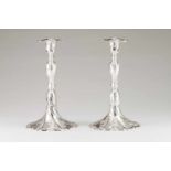 A pair of large apron candlesticks