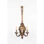 A pair of Louis XVI style three-light wall lights