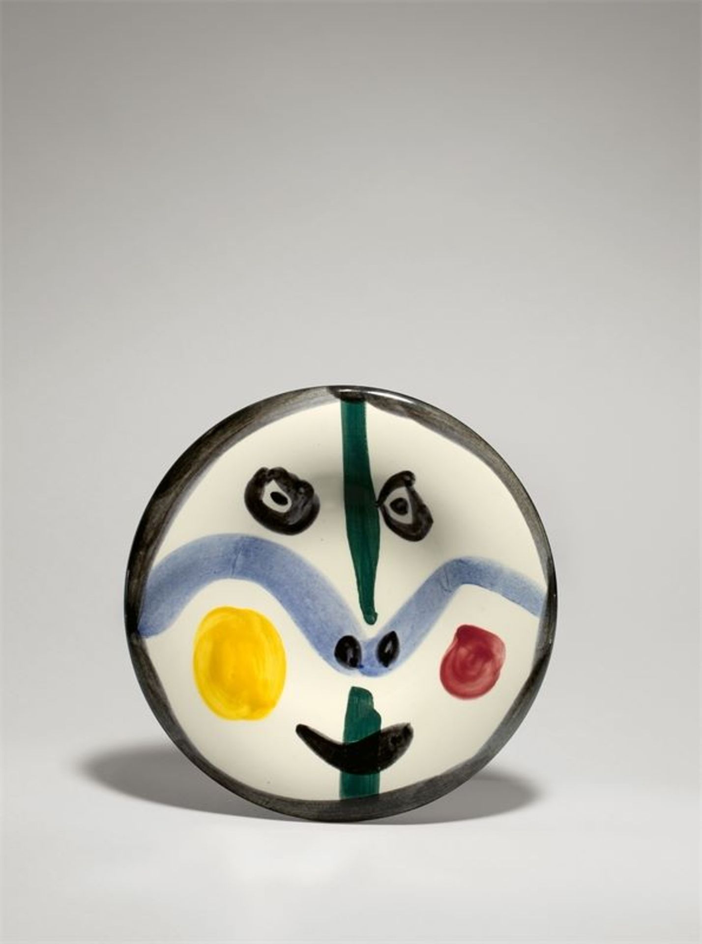 Pablo Picasso (Málaga 1881 – 1973 Mougins)„Visage no. 0“. 1963Runder Teller, weißer Ton, mit