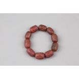 A RARE RED JADE BRACELET