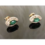 A Pair of 14CT Emerald Ear Stud