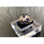 A 14CT Gold Sapphire and Diamond Ring