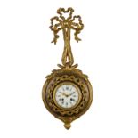 OROLOGIO D'APPLIQUES IN BRONZO DORATO E METALLO PATINATO,