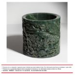 **A HIGHLY IMPORTANT AND FINELY CARVED LARGE SPINACH-GREEN JADE