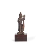 A SMALL CARVED WOOD FIGURE OF A DEITY, CHINA,