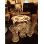 Four cut glass vases various sizes and o