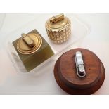 Group of three Colibri table lighters