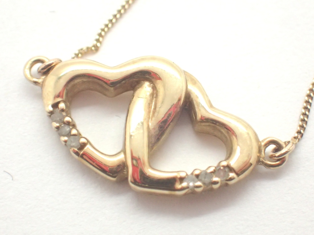 9ct gold diamond set twin heart pendant